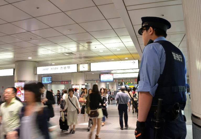 A Japanese policeman patrols a railway station in Tokyo, on June 9, 2012