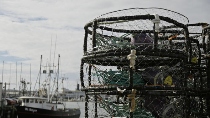 Crab pots are stacked along a pier at Fisherman&#39;s Wharf, Thursday, Nov. 5, 2015, in San Francisco. Wildlife authorities delayed the Dungeness crab season and closed the rock crab fishery for most of California on Thursday, just days after warning of dangerous levels of a neurotoxin linked to a massive algae bloom off the coast. (AP Photo/Eric Risberg)