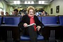 File photo of Helen Thomas taking her seat after recovering from a long illness in the Briefing Room at the White House