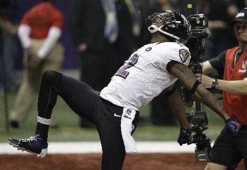 Baltimore Ravens wide receiver Jacoby Jones (12) reacts after returning a kickoff for a 108-yard touchdown against the San Francisco 49ers during the second half of the NFL Super Bowl XLVII football game, Sunday, Feb. 3, 2013, in New Orleans