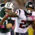 Houston Texans running back Arian Foster rushes against the New York Jets during the first quarter of their NFL football game in East Rutherford
