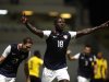US Eddie Johnson, center, celebrates after scoring against Antigua and Barbuda during a 2014 World Cup qualifying soccer match in St. John, Antigua and Barbuda, Friday, Oct. 12, 2012. (AP Photo/Ricardo Arduengo)