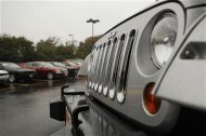 A Jeep Wrangler (R) is shown at the Criswell Chrysler-Dodge-Jeep-Fiat dealership in Gaithersburg, Maryland October 2, 2012. REUTERS/Gary Cameron