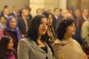 Egyptians sing during Christmas Eve Mass at the Coptic Orthodox Church of Virgin Mary in Cairo, Egypt, Monday, Jan. 6, 2014. Millions of Egyptian Christians on Monday thronged churches across the mainly Muslim nation for Christmas Mass, held amid unusually tight security but with congregations filled with hope ahead of a key vote this month on constitutional amendments that enshrine equality and criminalize all types of discrimination. (AP Photo/Amr Nabil)