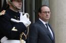 French President Francois Hollande stands outside the Elysee Palace in Paris on November 19, 2015