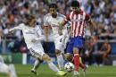Real's Luka Modric,left and Real's Sami Khedira, centre, fight for the ball with Atletico's Diego Costa, during the Champions League final soccer match between Atletico Madrid and Real Madrid in Lisbon, Portugal, Saturday, May 24, 2014. (AP Photo/Francisco Seco)