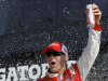 Driver Kevin Harvick celebrates in victory lane after winning the first of two 150-mile qualifying races for the NASCAR Daytona 500 auto race at Daytona International Speedway, Thursday, Feb. 21, 2013, in Daytona Beach, Fla. (AP Photo/Terry Renna)