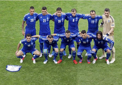 Greece's national soccer team pose for the picture before the start of their Group A Euro 2012 soccer match against Poland at the National Stadium in Warsaw