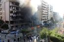 Flames rise from the site of a blast in Bir Hassan neighbourhood in the southern Beirut, on November 19, 2013