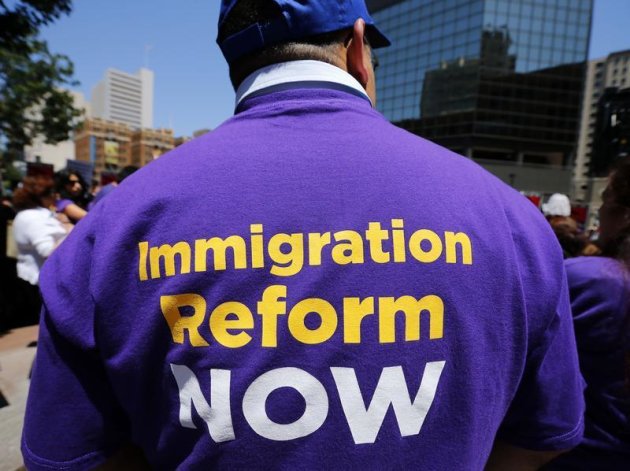 The t-shirt of an immigrant supporter is seen as families, workers and supporters rally in front of the Federal building downtown to protest the United States Department of Homeland Security I-9 audits of their employment eligibility in San Diego, California April 26, 2013. REUTERS/Mike Blake