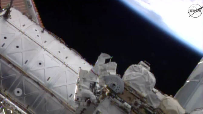 In this image taken from NASA TV, American astronaut Reid Wiseman works outside the International Space Station on Tuesday, Oct. 7, 2014. Wiseman and German spaceman Alexander Gerst are performing NASA&#39;s first routine maintenance outside the International Space Station in more than a year. (AP Photo/NASA)
