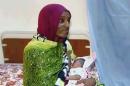 In this file image made from an undated video provided Thursday, June 5, 2014, by Al Fajer, a Sudanese nongovernmental organization, Meriam Ibrahim breastfeeds her newborn baby girl that she gave birth to in jail last week, as the NGO visits her in a room at a prison in Khartoum, Sudan. Sudan's official news agency, SUNA, said the Court of Cassation in Khartoum on Monday, June 23, canceled the death sentence against 27-year-old Meriam Ibrahim after defense lawyers presented their case. The court ordered her release. (AP Photo/Al Fajer, File)