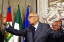Italian President Napolitano gestures after a news conference in Rome