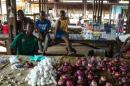 Boys sit in a market in the centre of Bangui on February 13, 2014