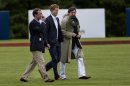 Britain's Prince Harry walks across the polo field before the Sentebale Royal Salute Polo Cup charity match in Greenwich, Conn., Wednesday, May 15, 2013. Right is Peter Brant, founder of the Greenwich Polo Club. (AP Photo/Craig Ruttle)