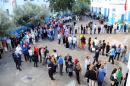 Tunisians queue outside a polling station in La Marsa, Tunisia, Sunday Oct. 26, 2014. Tunisians expressed tentative hope for the future as they lined up early Sunday to choose their first five-year parliament since they overthrew their dictator in the 2011 revolution that kicked off the Arab Spring. (AP Photo/Hassene Dridi)