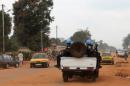 Soldiers of the UN MINUSCA force sit on a vehicle on September 15, 2014, in Bangui