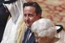 Britain's Prime Minister David Cameron listens to Queen Elizabeth deliver a speech at a State Luncheon for United Arab Emirates President Sheikh Khalifa bin Zayed al-Nahayan in Windsor