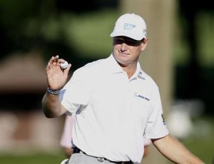South Africa's Ernie Els reacts after his par on the 10th green during the first round of the 2013 PGA Championship golf tournament at Oak Hill Country Club in Rochester