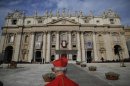 A cardinal arrives to attend a mass celebrated by Pope Benedict XVI marking the opening of the Synod of bishops in St. Peter's square at the Vatican