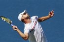 Roddick of the U.S. serves to compatriot Williams during their men's singles match at the U.S. Open tennis tournament in New York