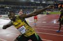 Jamaica's Usain Bolt celebrates after anchoring the Jamaican team to the gold medal in the Men's 4x100m relay at Hampden Park Stadium during the Commonwealth Games 2014 in Glasgow, Scotland, Saturday Aug. 2, 2014. (AP Photo/Frank Augstein)