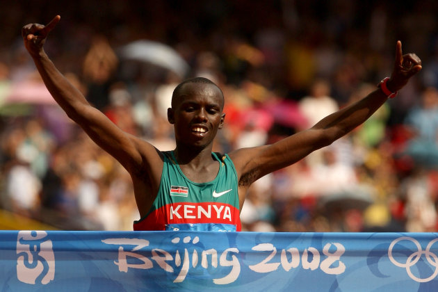 Sammy Wanjiru of Kenya crosses the finish line to win the men's marathon in the National Stadium during Day 16 of the Beijing 2008 Olympic Games on August 24, 2008. (Photo by Mark Dadswell/Getty Images)