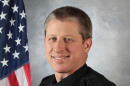 This photo provided by the University of Colorado at Colorado Springs shows officer Garrett Swasey, who was killed in a shooting at a Planned Parenthood clinic in Colorado Springs, Colo., Friday, Nov. 27, 2015. A gunman who opened fire inside a Colorado Springs Planned Parenthood clinic was arrested Friday after engaging in gun battles with authorities during an hours-long standoff that killed several, including Swasey, and wounded others, officials said. (University of Colorado at Colorado Springs via AP)
