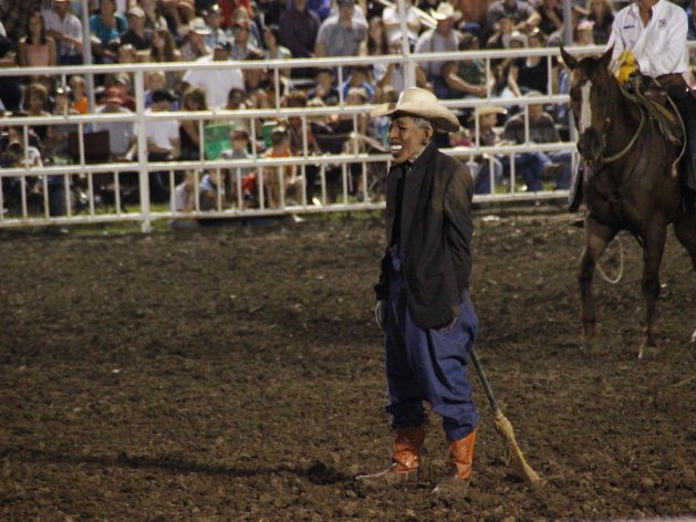 This photo provided by Jameson Hsieh shows a clown wearing a mask intended to look like President Obama at the Missouri State Fair. The announcer asked the crowd if anyone wanted to see “Obama run down by a bull,” according to a spectator. “So then everybody screamed. ... They just went wild,” said Perry Beam, who attended the rodeo at the State Fair in Sedalia on Saturday Aug. 10, 2013. State Fair officials apologized calling the display inappropriate and disrespectful. (AP Photo/Jameson Hsieh)