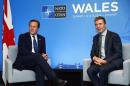 Britain's Prime Minister Cameron and NATO's Secretary General Rasmussen attend a bilateral meeting at Celtic Manor golf club near Newport in Wales