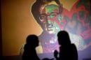 An image of U.S. director Woody Allen is projected on a wall at an art exhibit titled "Queremos tanto a Woody," or "We so love Woody" by Argentine artist Hugo Echarri in Buenos Aires, Argentina, Thursday, Feb. 6, 2014. The exhibit in honor of Allen was inaugurated just days after the artist faced renewed accusations that he molested Dylan Farrow, his then-7-year-old adopted daughter in 1992. (AP Photo/Rodrigo Abd)