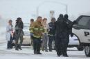 Hostages are escorted to an ambulance during an active shooter situation near a Planned Parenthood facility on November 27, 2015 in Colorado Springs, Colorado
