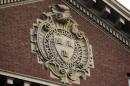 A seal hangs over a building at Harvard University in Cambridge