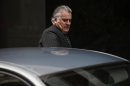Former People's Party treasurer Barcenas enters a car as he leaves Spain's High Court after appearing before a judge in Madrid