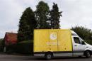An Ocado delivery truck drives through Fingest in southern England