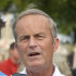 In this Thursday, Aug. 16, 2012 photograph, Rep. Todd Akin, R-Mo., talks with reporters while attending the Governor's Ham Breakfast at the Missouri State Fair in Sedalia, Mo. Akin was keeping a low profile, Monday, Aug. 20, 2012, a day after a TV interview in which he said that women's bodies can prevent pregnancies in "a legitimate rape" and that conception is rare in such cases. (AP Photo/Orlin Wagner)