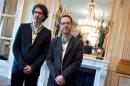 US directors Joel and Ethan Coen (R) pose for photographers at the Culture ministry in Paris, on October 16, 2013, after they were awarded as Officier des Arts et des Lettres, a French cultural award