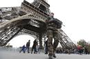 French military patrol near the Eiffel Tower the day after a series of deadly attacks in Paris