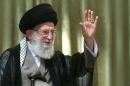A handout picture released by the official website of the Iranian supreme leader Ayatollah Ali Khamenei shows him waving after delivering a speech in Tehran on June 4, 2014