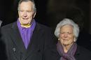Former US President George H.W. Bush (L) and his wife Barbara, pictured in 2009, are both hospitalized in Houston