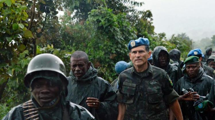 DR Congo Army General Bahuma Ambamba (2nd L) walks with UN mission in DR Congo (MONUSCO) General Carlos Alberto Dos Santos of Brazil on November 5, 2013 near Chanzu, in the eastern North Kivu region