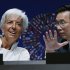 International Monetary Fund Managing Director Christine Lagarde, left, speaks with IMF Corporate Secretary Lin Jianhai at the opening of the annual meetings plenary of IMF and World Bank Group in Tokyo, Friday, Oct. 12, 2012. (AP Photo/Koji Sasahara)