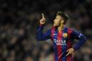 Barcelona's Neymar celebrates his side's 2nd goal during the Group F Champions League soccer match between FC Barcelona and PSG at the Camp Nou stadium in Barcelona, Spain, Wednesday Dec. 10, 2014. (AP Photo/Manu Fernandez)