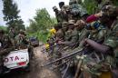 Jeeps full of M23 rebels drive towards the town of Sake in the east of the Democratic Republic of the Congo on November 30, 2012