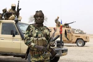 Chadian soldier poses for picture at front line during battle against insurgent group Boko Haram in Gambaru