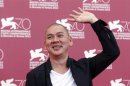 Director Ming-Liang, poses during a photocall for the movie "Stray Dogs", directed by him, during a photocall for the movie "Stray Dogs" during the 70th Venice Film Festival in Venice