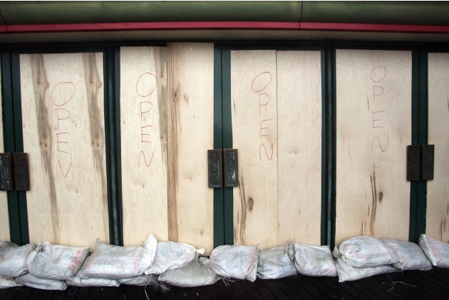 An entrance to a casino which has been boarded and sandbagged for protection from Hurricane Sandy, has "Open" handwritten on the doors, on the Atlantic City boardwalk