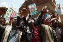 Supporters of the Shiite Huthi movement shout slogans during an anti-government demonstration in Sanaa on September 3, 2014
