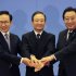 South Korea's President Lee Myung-bak, left, China's Premier Wen Jiabao, center, and Japan's Prime Minister Yoshihiko Noda hold their hands together as they pose for photographs ahead of the fifth trilateral summit among the three nations in Beijing, Sunday, May 13, 2012. (AP Photo/Petar Kujundzic, Pool)