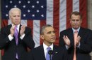 U.S. House Speaker Boehner and Vice President Biden stand to applaud as President Obama delivers his State of the Union speech on Capitol Hill in Washington